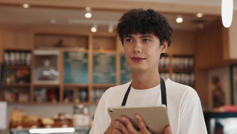 man working at cafe