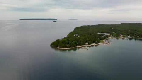 aerial view of a forested island peninsula on a large lake