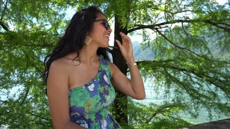 happy woman appreciating views at lake como in lombardy, italy - close up