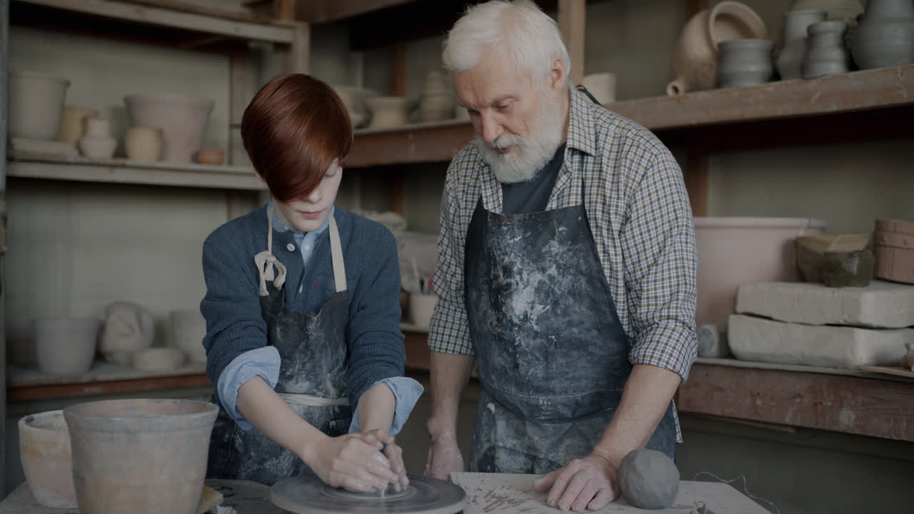 Grandfather and Grandson Learning Pottery Together