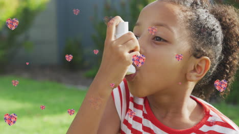 animación de corazones de flores sobre chica afroamericana usando inhalador en el jardín