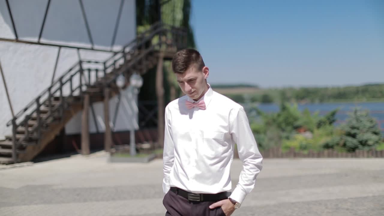 Alone Groom Waiting For Bride. Alone groom walk at the coast and waiting for bride
