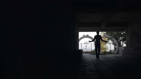 Man-skipping-in-the-yard-and-listening-to-music