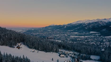 Beautiful-Aerial-Drone-Sunset-of-Distant-Landscape-surrounding-Hotel-Bachleda-winter-snow---Poland