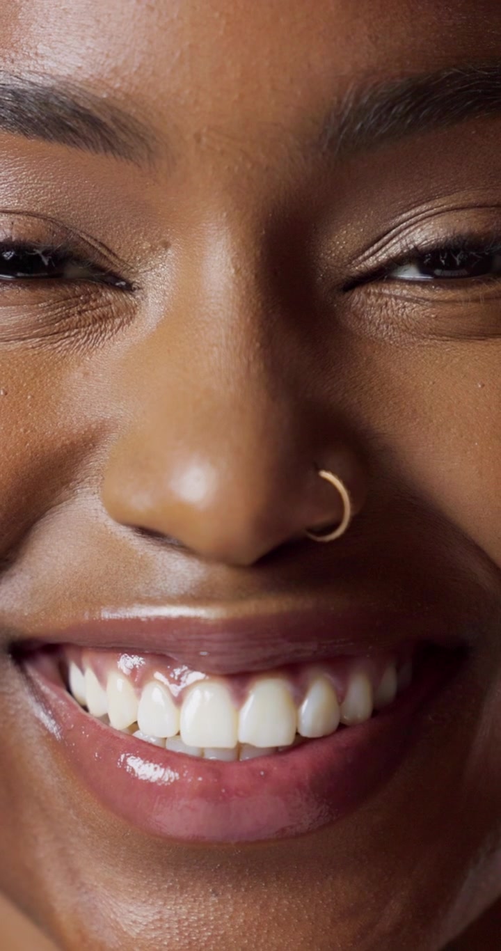 Close-up Portrait of a Smiling Young Black Woman