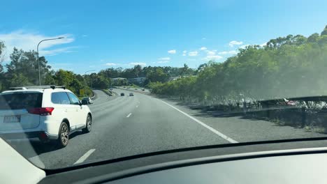 electric car driving on a sunny motorway