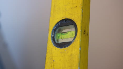 close up of workmans spirit level shot in slow motion