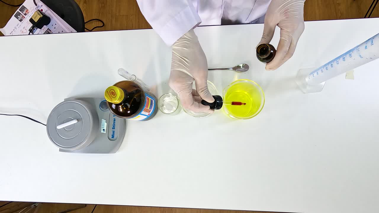 A scientist conducts an iodine clock reaction experiment on a lab table with precise chemical mixing