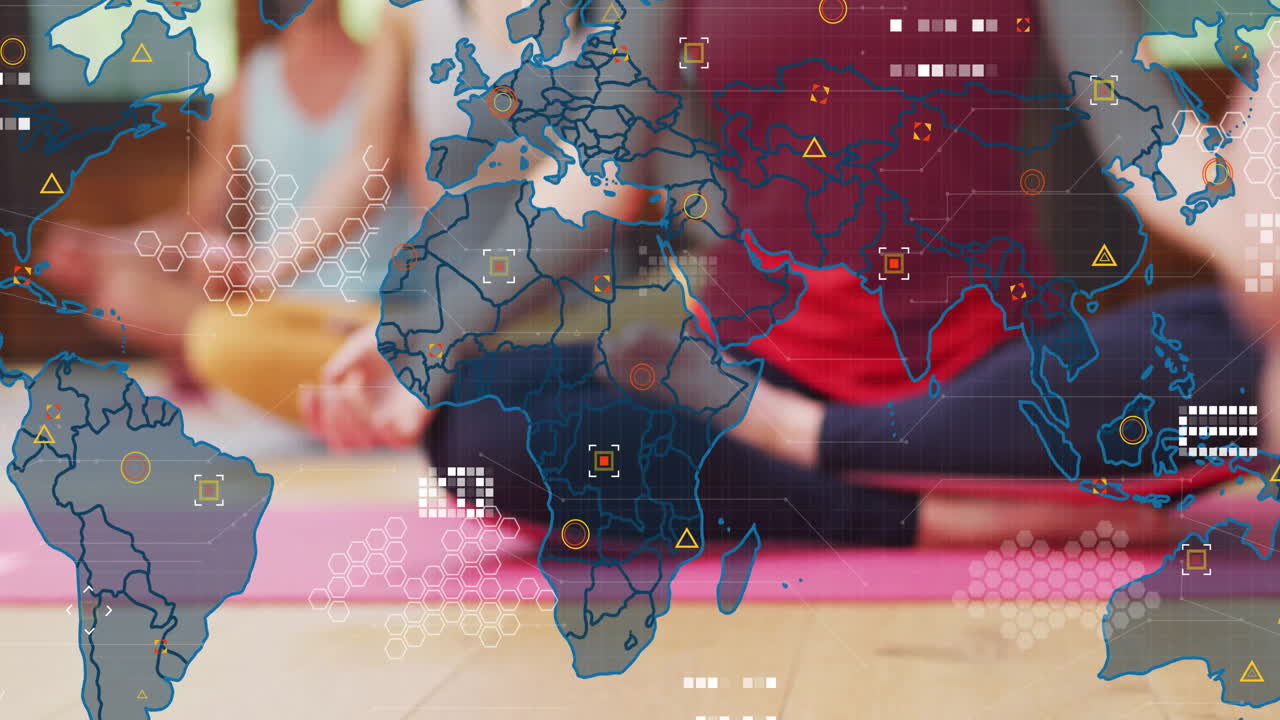Group practicing yoga on mats in wellness session showing world map overlay  and  hexagon grid graph