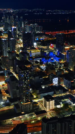 vast scenery of magnificent miami, florida, usa with billions of lights on. night panorama of metropolis from top. vertical video