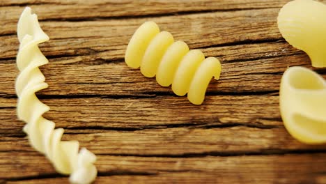 various pasta on wooden table