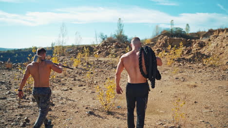 fitness training outdoor. young muscular men outdoor exercising in nature