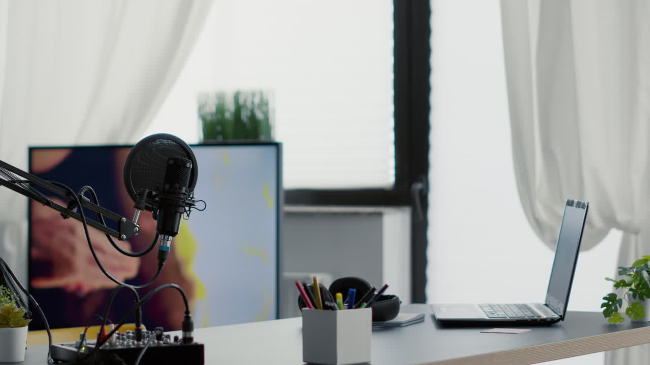 Empty streaming studio booth with modern professional audio equipment