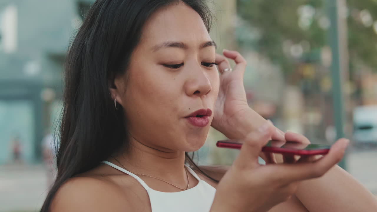 Young Asian Woman Talking on Phone