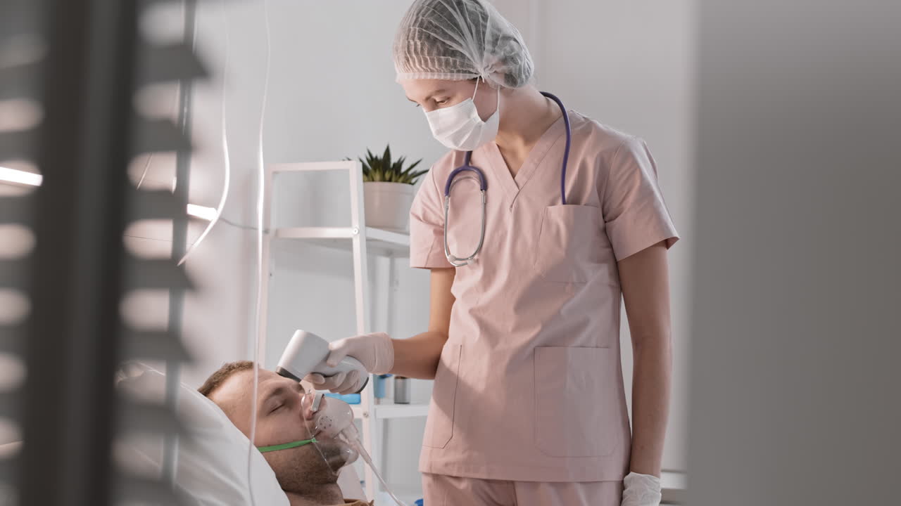 Nurse Measuring Temperature of Patient
