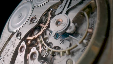 intricate close-up of a vintage pocket watch mechanism