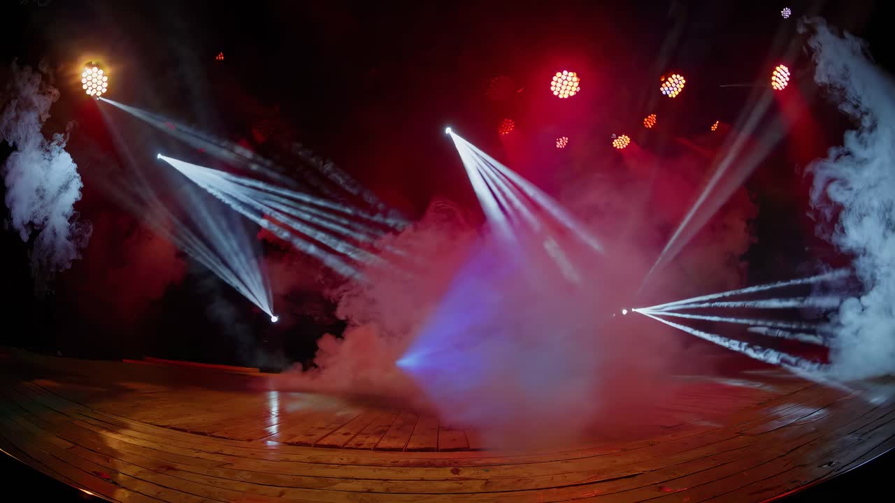 Dynamic stage with colorful lights and fog, captured from a low-angle, creating a dramatic