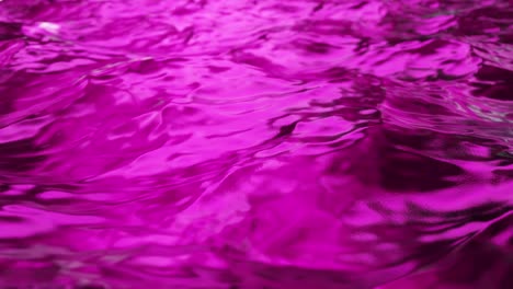 pure purple water in the pool with light reflections. slow motion. seamless loop 3d render.