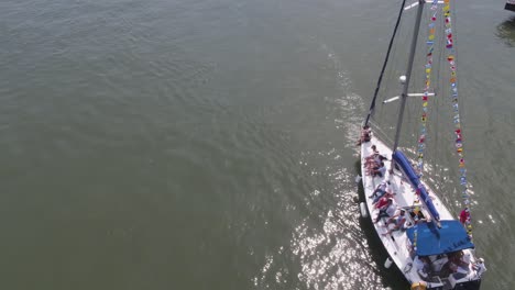 luxury yacht with people enjoying a day on the river