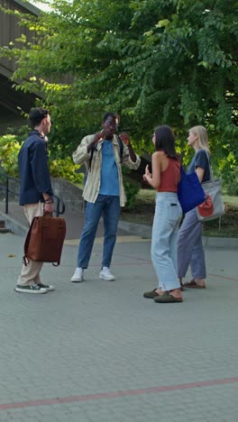 group of diverse students talking outdoors