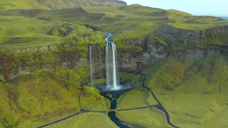 green scenic seljalandsfoss waterfall landscape incredible natural landmark view, static drone shot