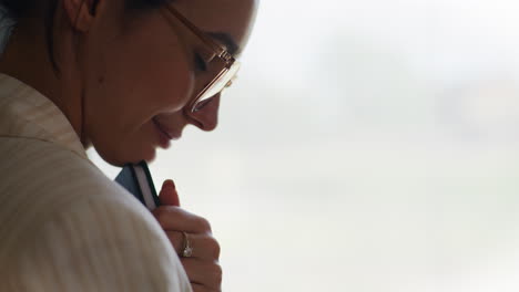 pensive woman holding notebook enjoying the moment