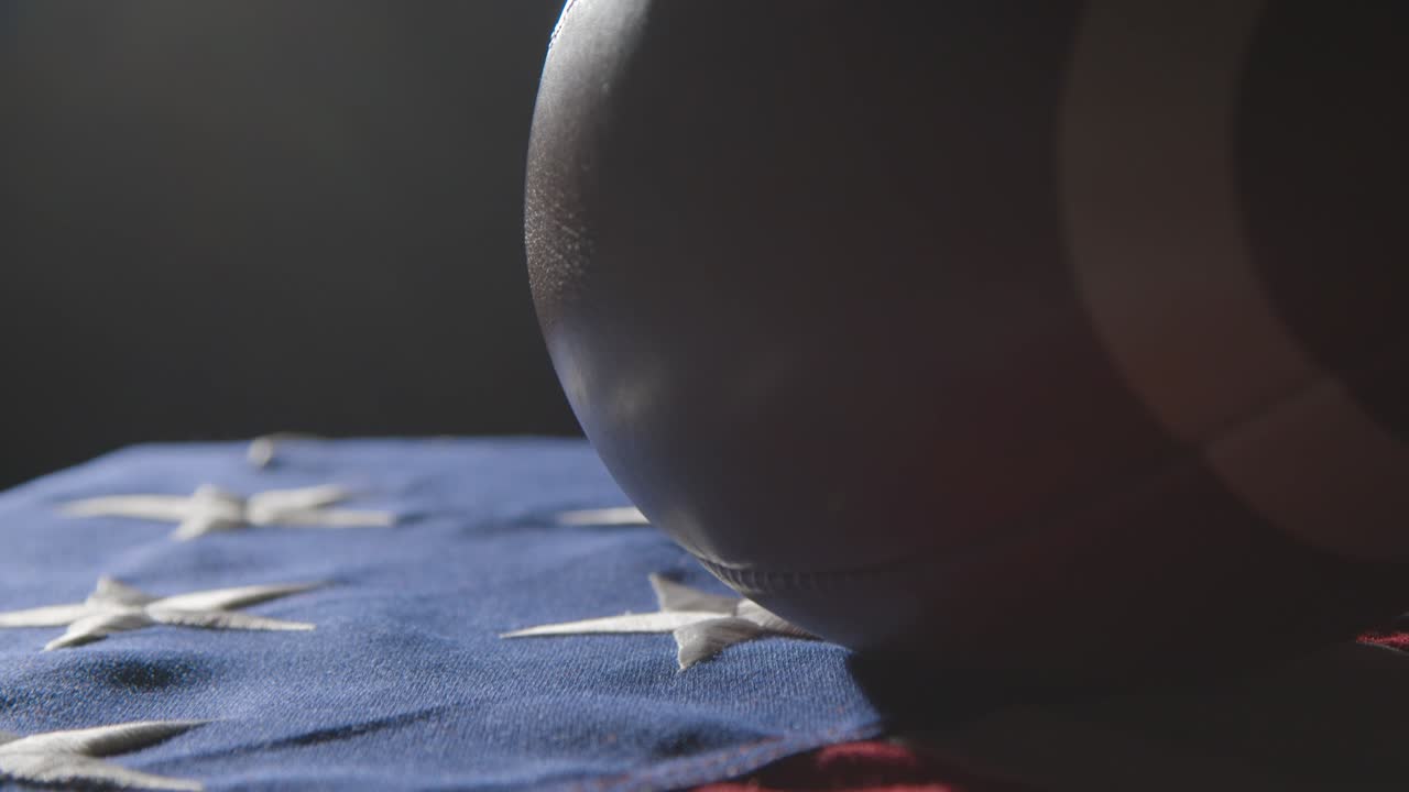 Close Up Studio Shot Of American Football On Stars And Stripes Flag 7