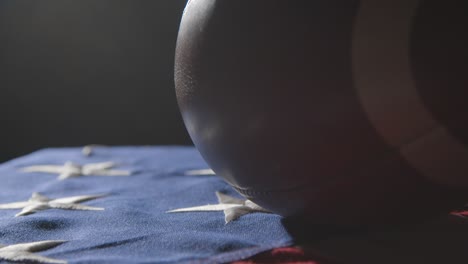 close up studio shot of american football on stars and stripes flag 7