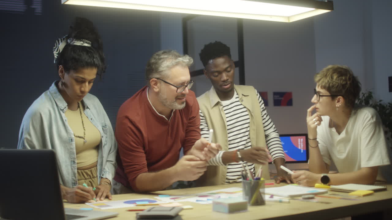 Creative Group Having Night Meeting in Office