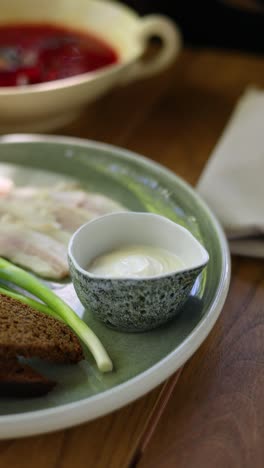 russian meal with borscht, salo, and bread