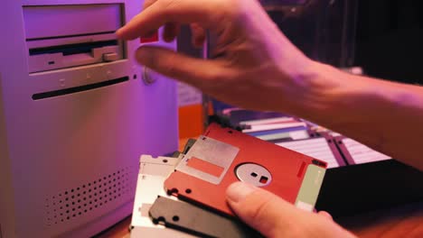 loading floppy disks into a vintage computer