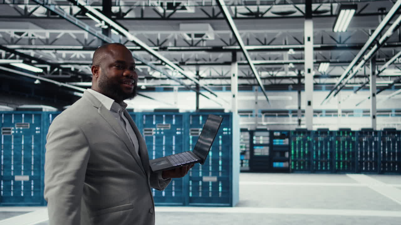 Vertical video Data center engineer deploying AI driven management tools using laptop