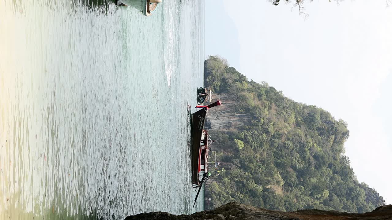 Wooden longtail boat in lagoon of island in Krabi, Thailand
