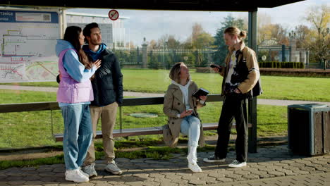 young people at bus stop