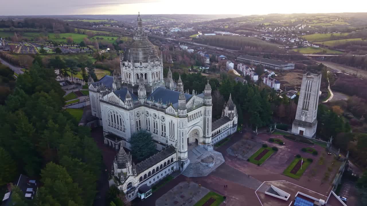 Basilica of Saint Thérèse, major catholic pilgrimage site and landmark in Lisieux, Normandy, France. Aerial drone orbiting