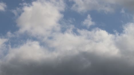 clouds drifting across a blue sky