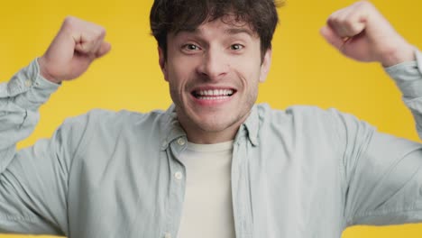 emotional sport fan. close up portrait of young excited man football supporter cheering on favorite soccer team