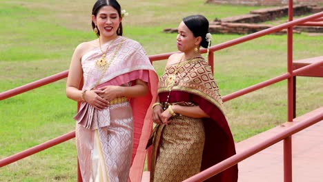 two women in traditional thai attire at ayutthaya