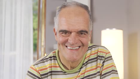 the old man is smiling.