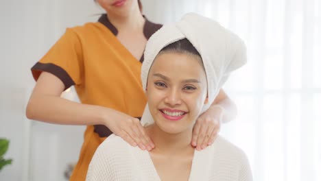 woman receiving a shoulder massage at a spa