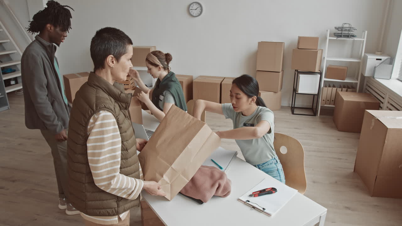 Volunteers Packing Donations into Boxes