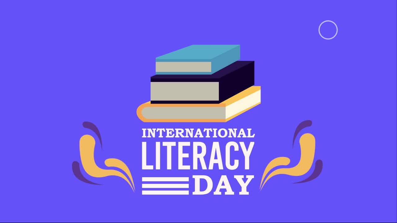 scritta buona giornata dell'alfabetizzazione e pila di libri