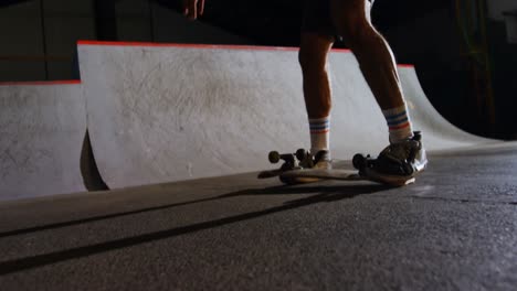 man practicing skateboarding in skateboard arena 4k