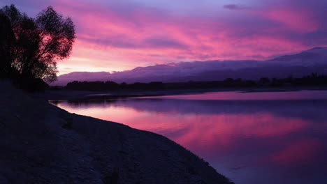 Pink-sunset-over-lake-and-mountains-New-Zealand