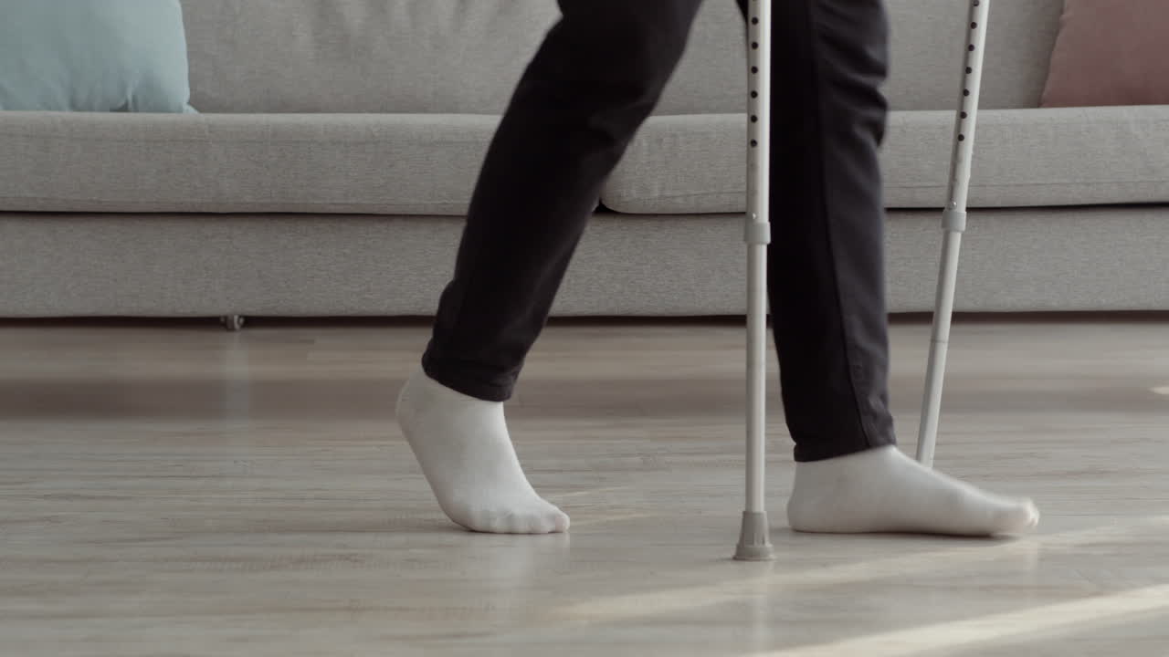 Person Walking with Crutches