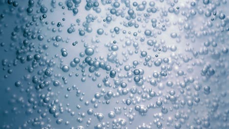 Many-water-bubbles-in-blue-water-close-up,-abstract-water-wave-with-bubbles-in-slow-motion.