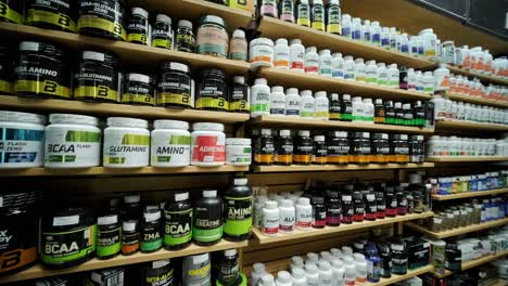 sport nutrition store interior with large choice of nutritional supplements.