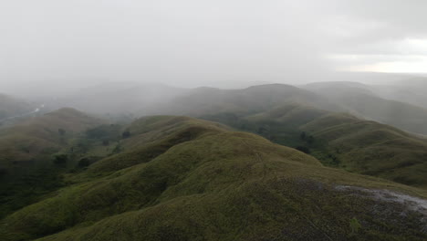 aerial view of mountain range covered with fog