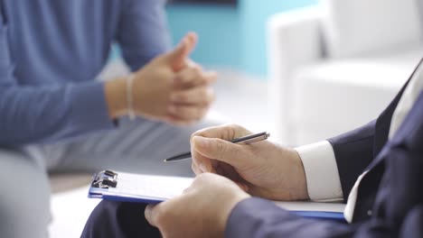 young male explaining his psychological problems and ailments to psychologist doctor.