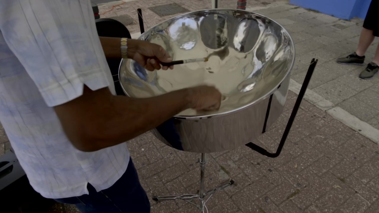 Close up of man's hands plays steeldrums. Steelband, steelpan, steeldrums from Trinidad and Tobago